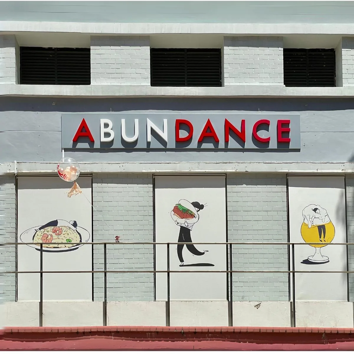 Abundance Redhill flagship dining room — warm cream walls, wooden tables.